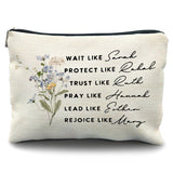A close-up product shot of a beige canvas makeup bag or zippered pouch. The bag features a delicate, illustrated floral bouquet on the left side and inspirational black text on the right that reads: 'Wait like Sarah, Protect like Rahab, Trust like Ruth, Pray like Hannah, Lead like Esther, Rejoice like Mary.