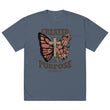A blue oversized t-shirt featuring a Christian graphic design of a butterfly, a wooden cross, and flowers with the text Created With A Purpose and the Bible verse reference Ephesians 2:10.-indigo.