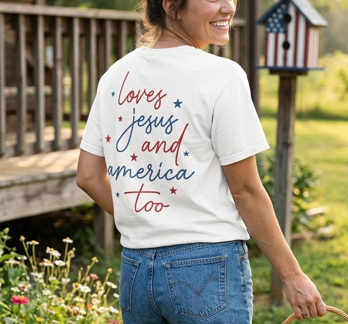 Woman styling a faith-based "loves jesus and america too" t-shirt in a summer garden.