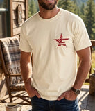 Man wearing a cream religious graphic tee with a distressed flag star design.