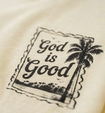 Detailed close-up of a black "God is Good" palm tree stamp faith design printed on high-quality cream fabric.