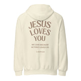 Isolated product view of a cream-colored heavy-weight hoodie featuring 'Jesus Loves You' and '1 John 4:19' printed in bold, earthy tones on the back.-Christian faith based 