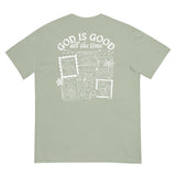 Flat lay back view of a sage green Christian shirt featuring the inspirational "God is Good all the time" stamp-style design.