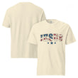 An ivory-colored unisex garment-dyed heavyweight t-shirt with a distressed patriotic "JESUS" print and star detailing