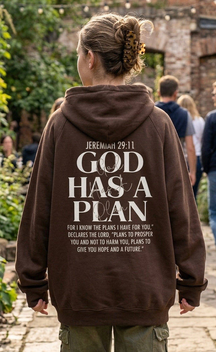 Lifestyle back view of person wearing brown unisex heavy weight hoodie with Jeremiah 29:11 Bible verse back print