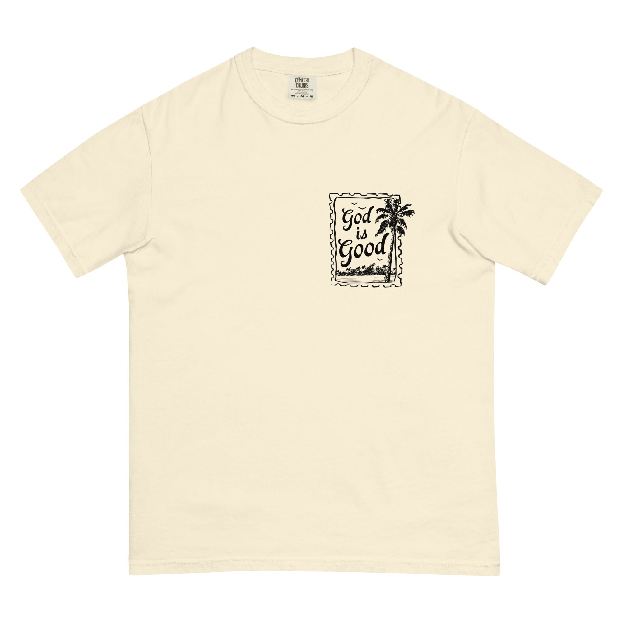 Flat lay front view of a cream minimalist Christian graphic tee with a black "God is Good" palm tree stamp design.