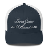 Front view of a navy and white retro trucker hat, Christian apparel with Loves Jesus and America too embroidery.