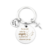 A silver keychain featuring three charms: a round charm engraved with 'For he will order his angels to protect you wherever you go' with angel wings, a small heart charm engraved with 'Psalm 91:11', and a small silver cross charm.
