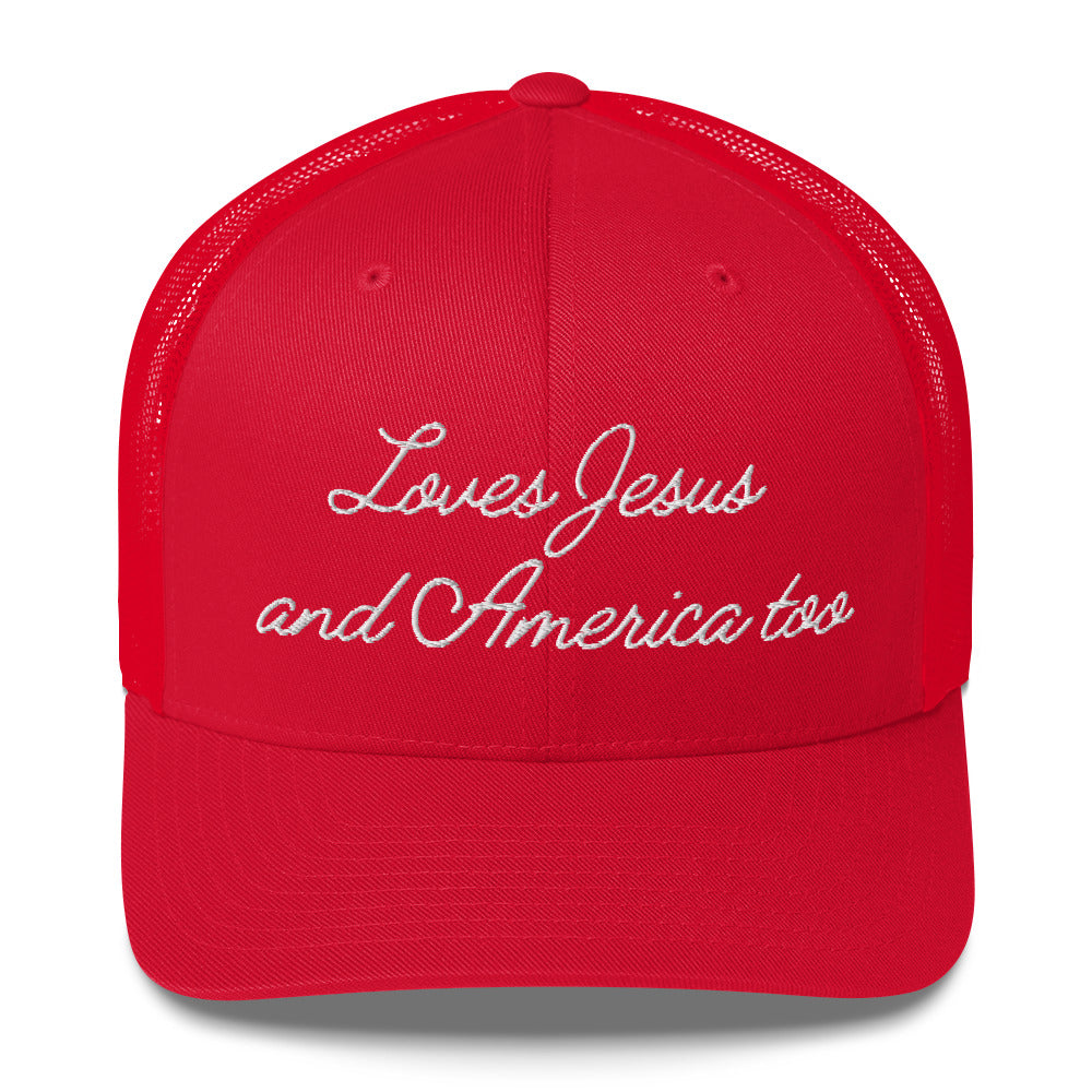 Front view of a red retro trucker hat with white embroidery reading Loves Jesus and America too.