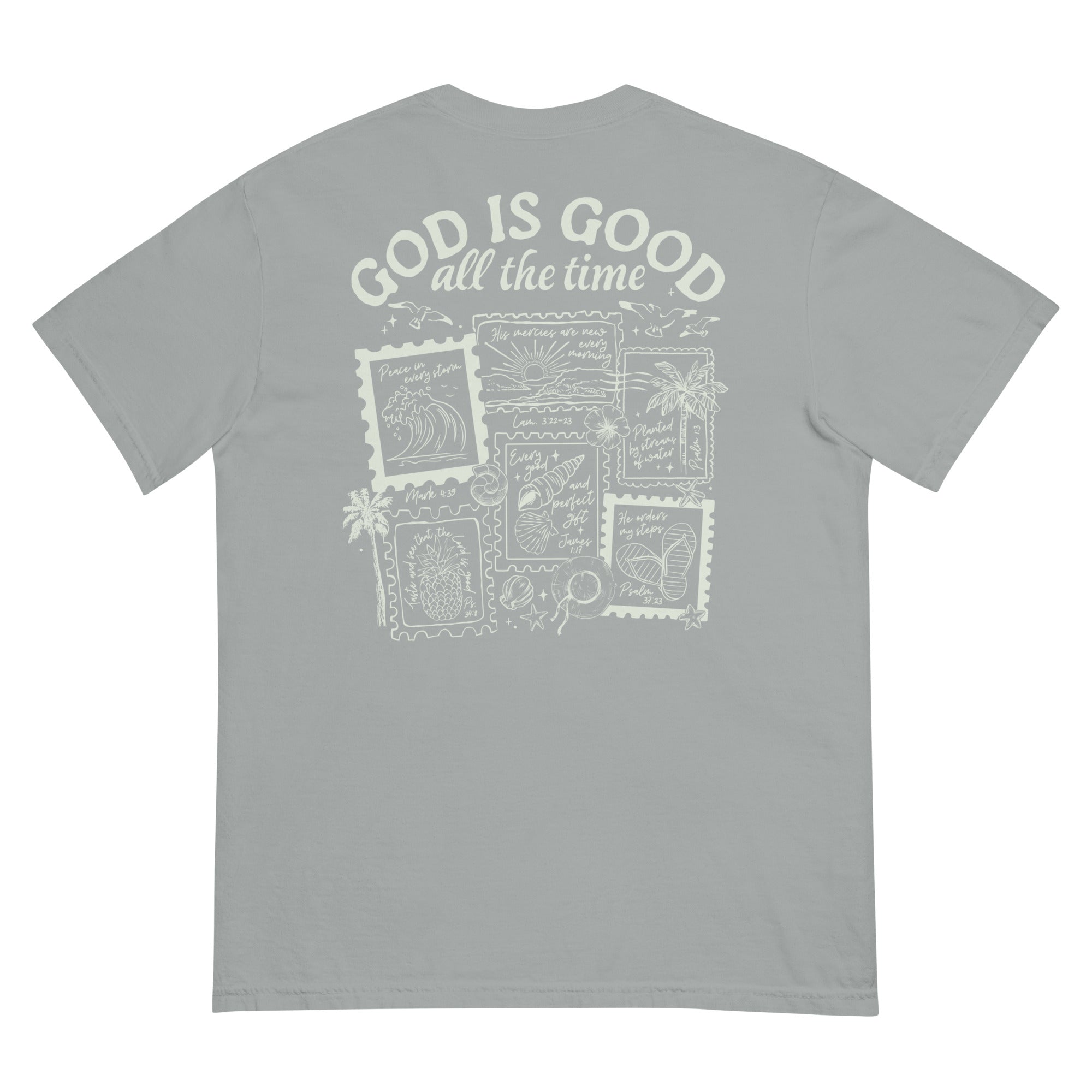 Flat lay back view of a sage green faith-based t-shirt featuring a "God is Good all the time" stamp-style inspirational graphic.