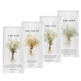 A set of four white waffle-weave kitchen towels displayed side-by-side, each featuring a different floral bouquet and the text "THE WAY," "THE TRUTH," "THE LIFE," and "THE HOPE," accompanied by Bible verse references.