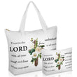A studio product photograph featuring a white tote bag and a matching smaller zippered pouch, both printed with a floral cross design and the Bible verse Proverbs 3:5-6, "Trust in the LORD with all your heart and lean not on your own understanding
